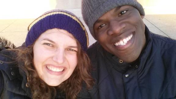 A man and woman smiling into the camera.